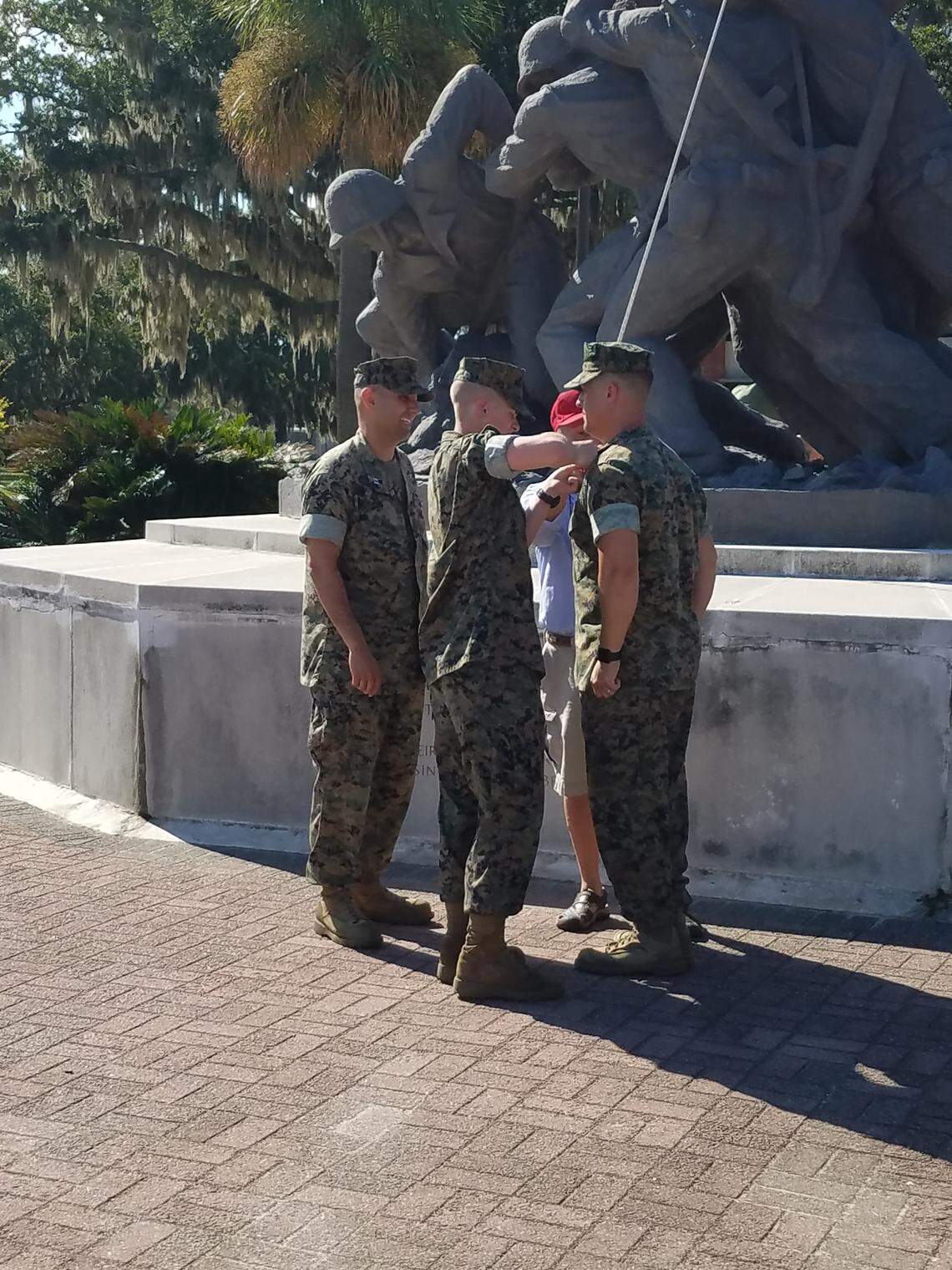 Newly minted Marine Pvt. Charlie Guarino pins on father Chief Warrant Officer 4 Wes Guarino’s new rank during a promotion ceremony on Thursday, Oct. 4, 2018, at Marine Corps Recruit Depot Parris Island, S.C.
