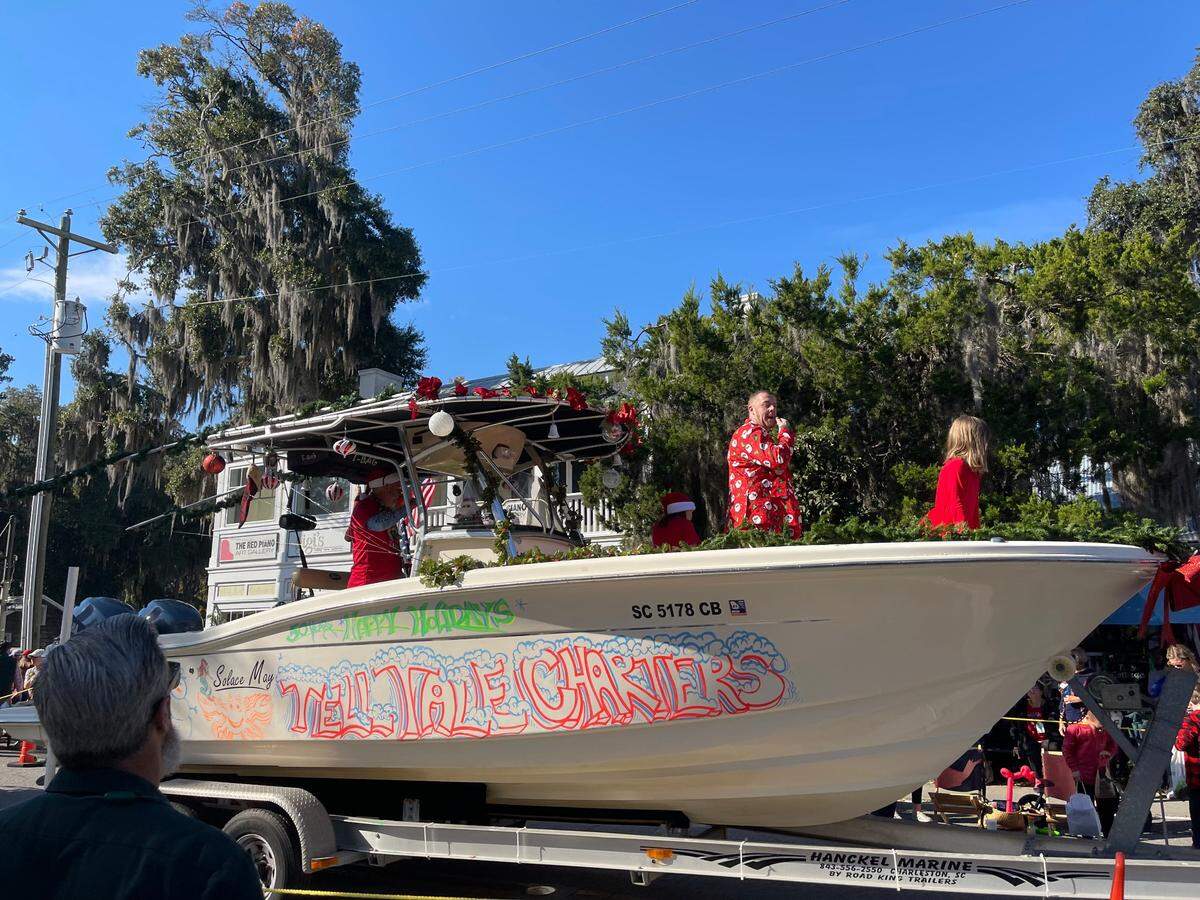 Representatives from Bluffton’s Tell Tale Charters glide through Bluffton’s 50th Annual Christmas Parade on Saturday Dec. 4.