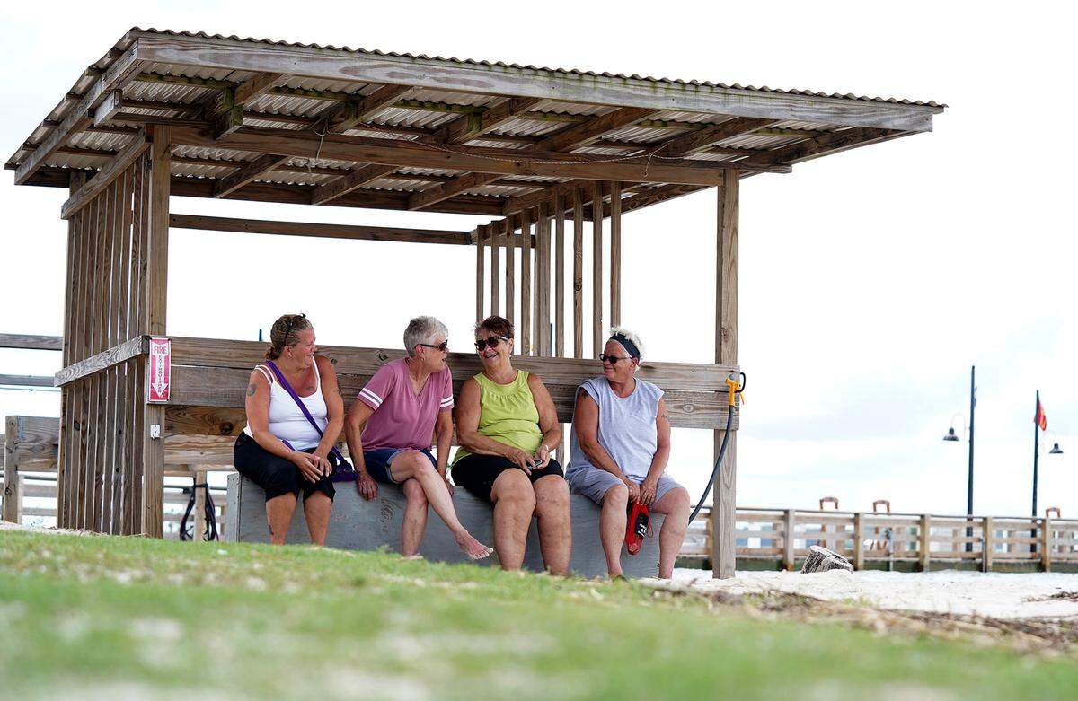 (Left-Right) Danielle Holland, Karen Casler, Margaret Windell and Robin Holland enjoy talking under a shelter along the water at Harbour Town in Sea Pines on Hilton Head Island, SC on Tuesday, September 3, 2019.