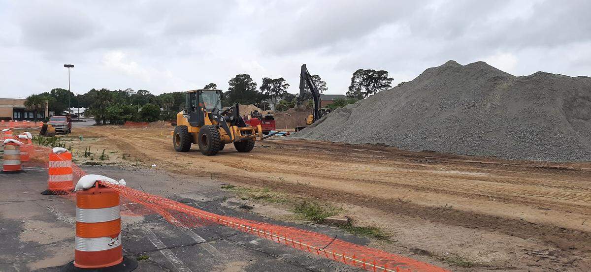 Workers were busy Monday at Beaufort Plaza where existing storefronts will be improved and a new Publix grocery store is planned.