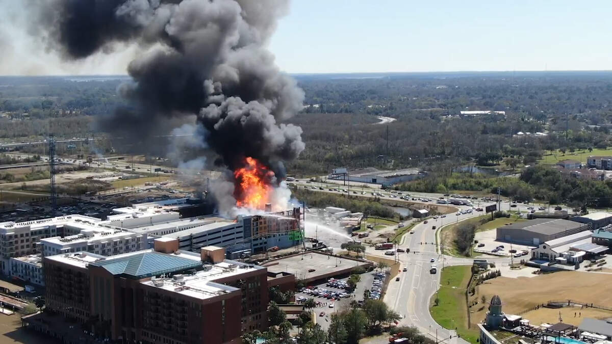 A still image from a video posted by the City of Savannah, Georgia, shows a fire blazing at the Eastern Wharf Project construction site downtown. The fire started before 1 p.m. on Thursday, Feb. 27, 2020.