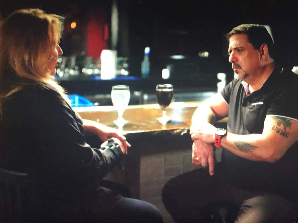 Michelle Licona talks with investigator Steve DiSchiavi in Nonna Lucia restaurant in Bluffton.