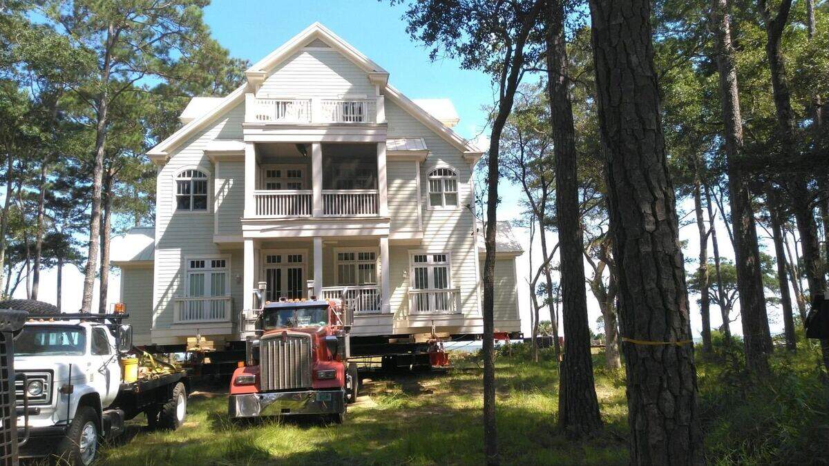 In this July 9, 2024 photo, the home is in place. The movers still need to raise it so that foundation work can begin. It will be an estimated eight weeks until the project is complete.