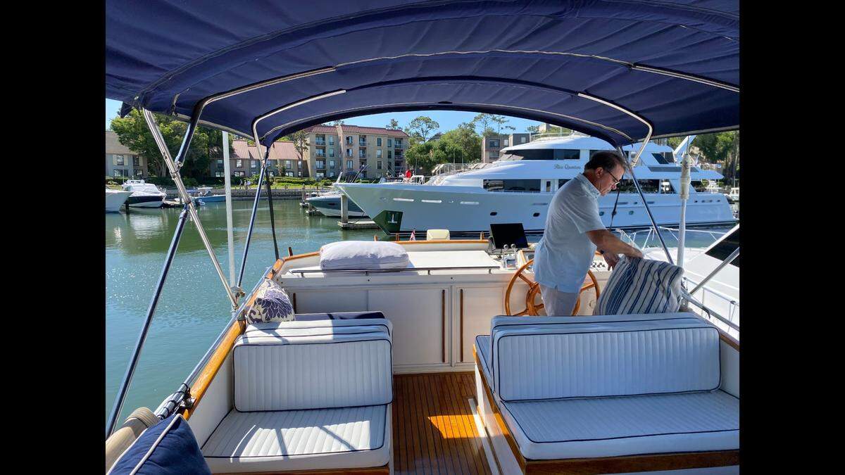 Greg Hall, a developer in Savannah, looks out over the Harbour Town marina during the RBC Heritage on Friday, April 15, 2022 on his 42-foot Grand Banks Europa yacht.