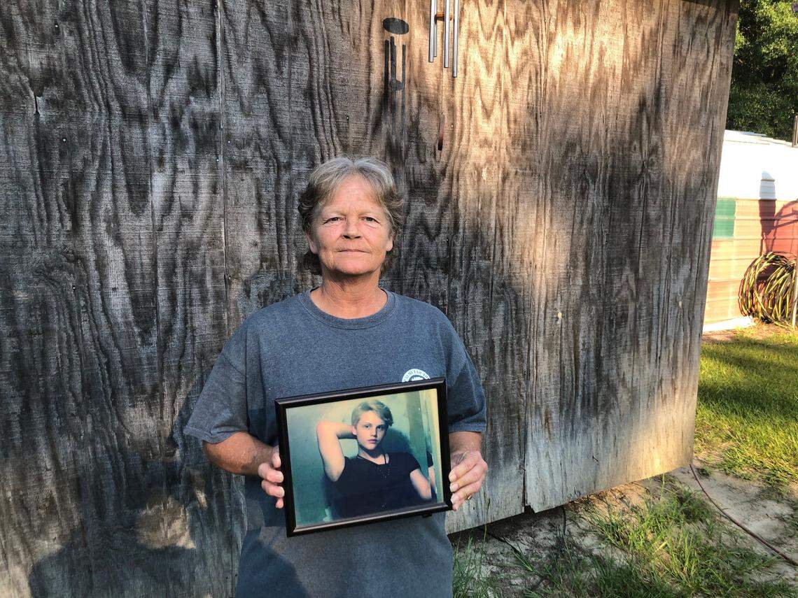 Sandy Smith holds a photo of her late son, 19-year-old Stephen Smith, on June 24, 2021. “There will never be another one like him,” she said.&nbsp; 
