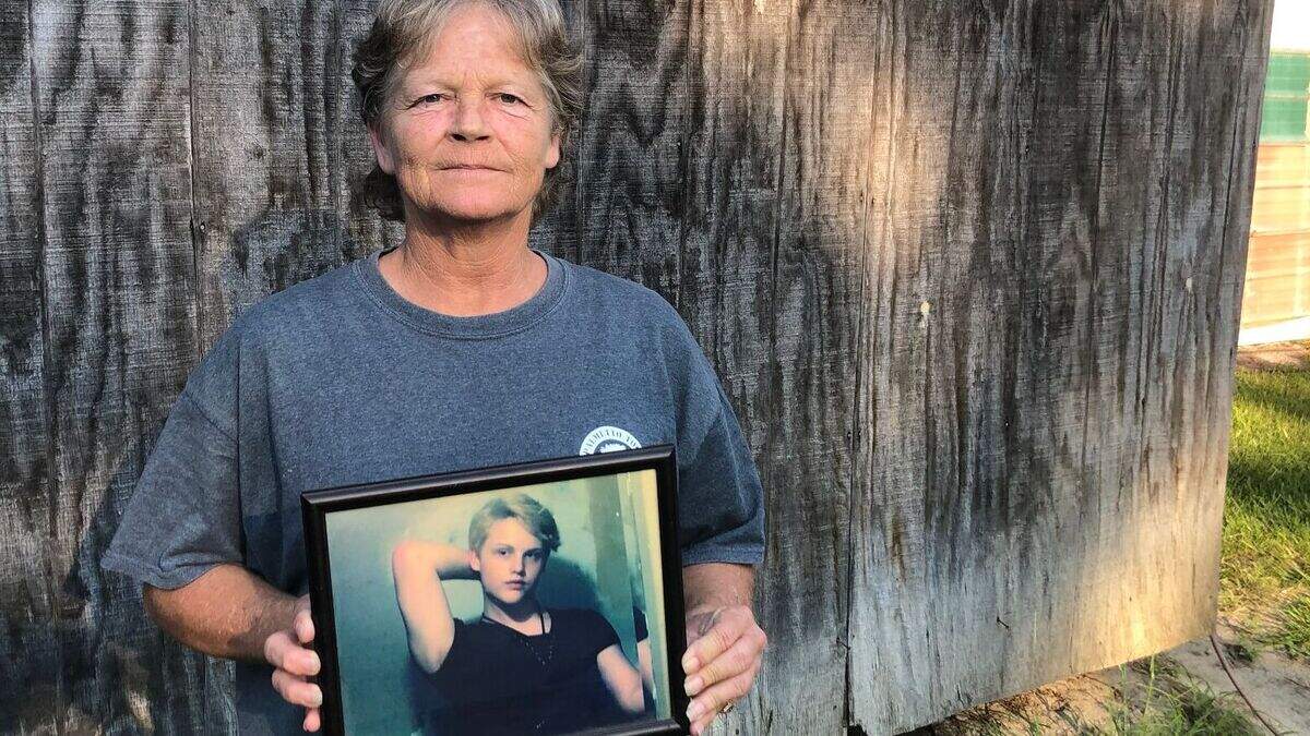 Sandy Smith holds a photo of her late son, 19-year-old Stephen Smith, on June 24, 2021. “There will never be another one like him,” she said.  