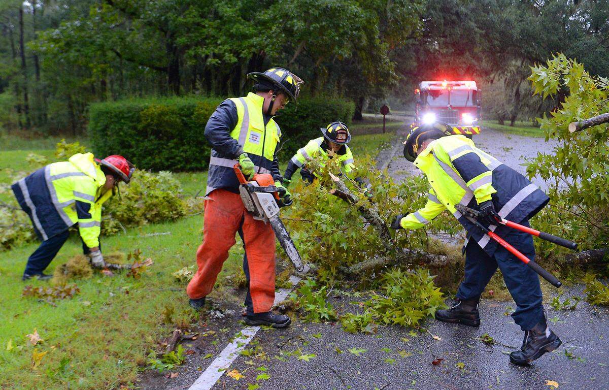 Town of Hilton Head Island Fire & Rescue Division work to remove a downed tree from a road in Hilton Head Plantation during Hurricane Dorian on Thursday, September 5, 2019 in Hilton Head Island, SC.