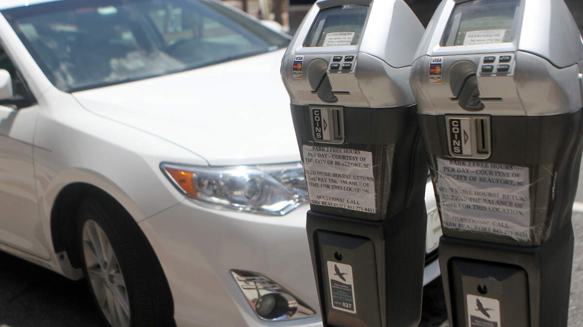 Parking meters advertising free two-hour parking line Bay Street and part of Carteret Street in downtown Beaufort on June 11, 2015.