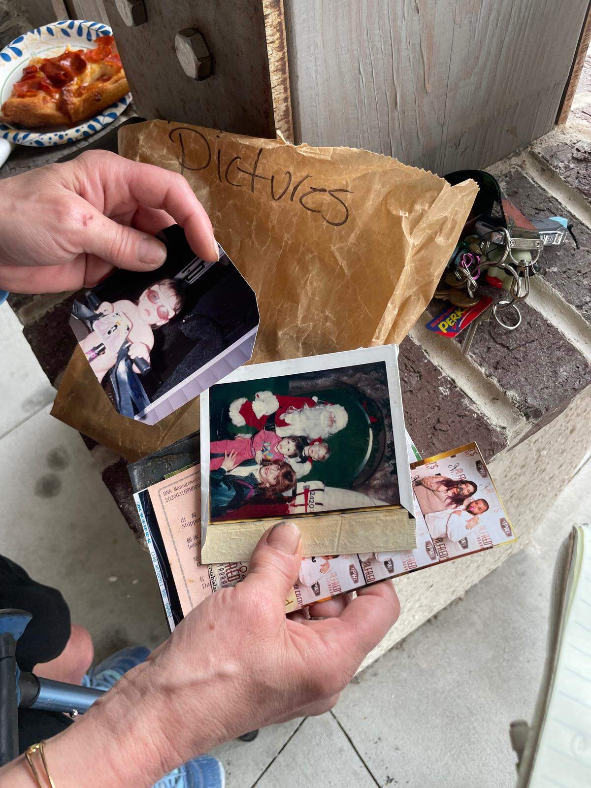 Jackie Kuhn leafs through childhood photo of her son John Kuhn at Lowcountry Celebration Park on Sep. 7, 2025. John, who died on Sep. 22, 2025, was a “leader,” Jackie said. 