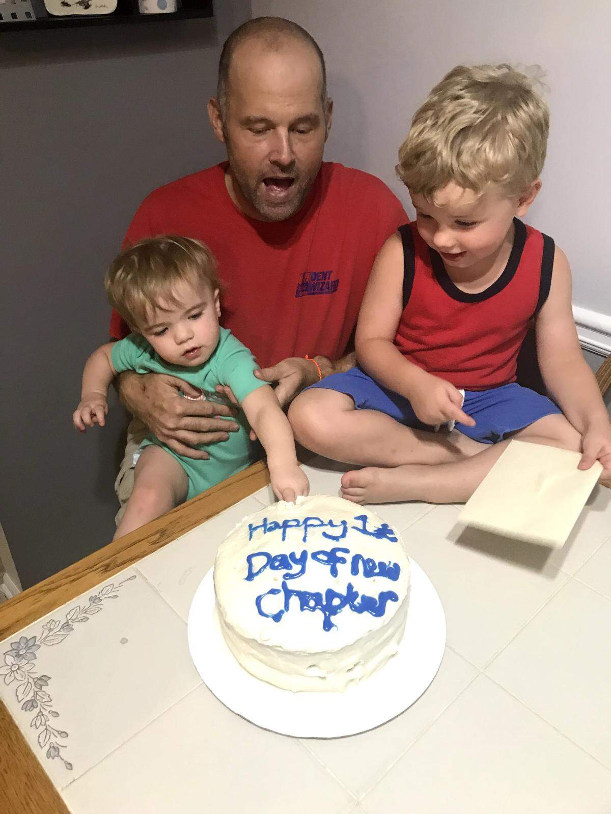 Dave Albany celebrates his “Happy 1st Day of New Chapter (of his life)” with children Norah (left) and Aidan.