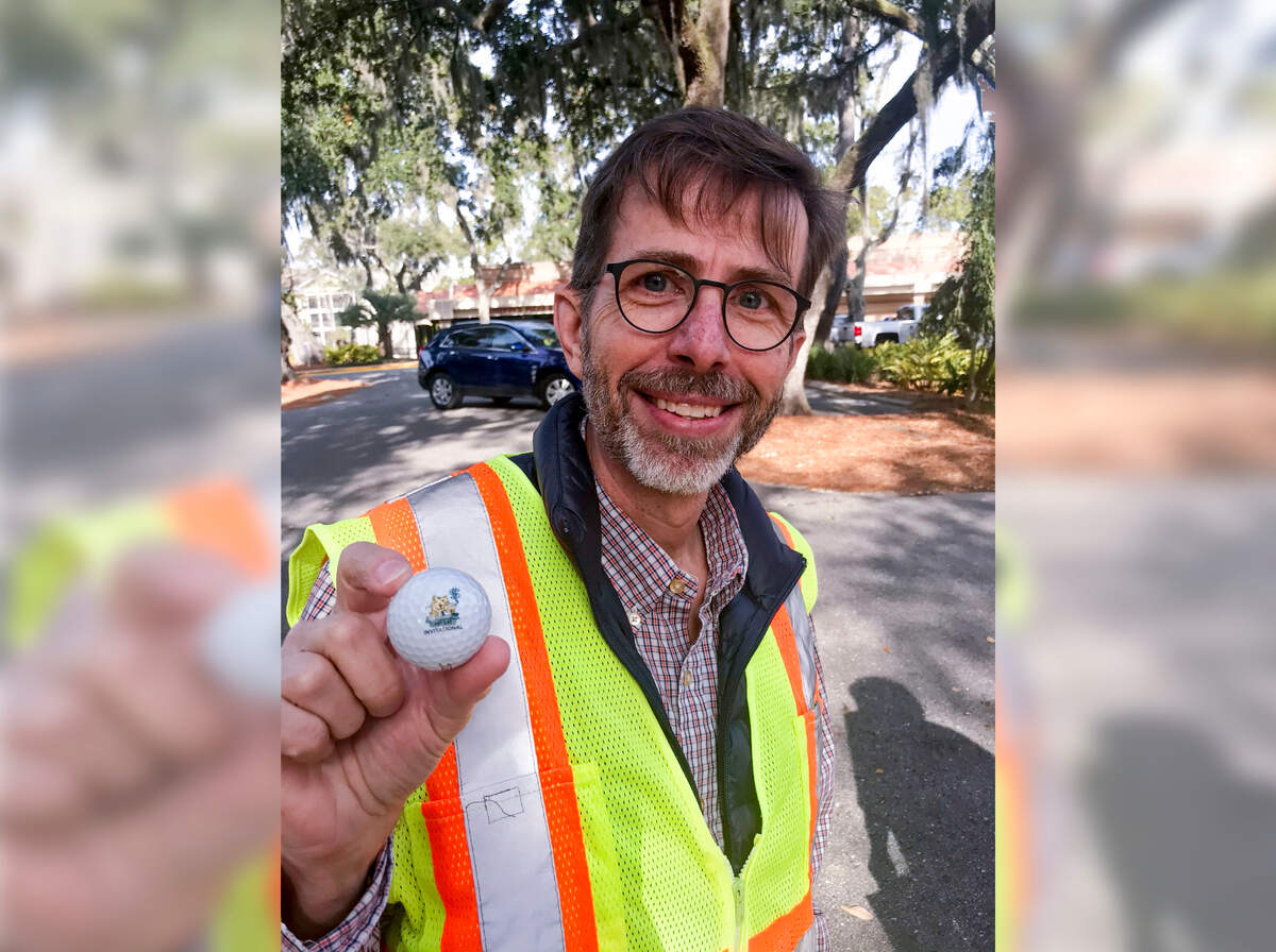 Scott Liggett on Feb. 5, 2020, showing one of the many odd things he said he found over the years as an engineer on Town of Hilton Head Island construction sites. This “Fat Cats Invitational” golf ball was found along William Hilton Parkway at Shelter Cove, where Liggett’s town staff went to great lengths to save the oak canopy in the median when the roadway was moved and lanes changed for increased safety.