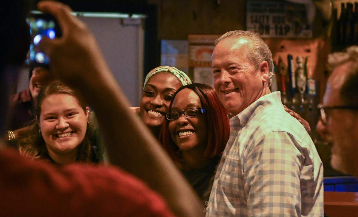 With only 38 of 98 precincts reporting and nearing midnight, Beaufort County Sheriff PJ Tanner poses for photos with staff at Salty Dog Bluffton in Tanger 2 on Tuesday, June 14, 2022 before calling it quits for the night. When asked if he was going to go home and wait for the final results, Tanner suggested he might “but that you have to go to sleep some time.”