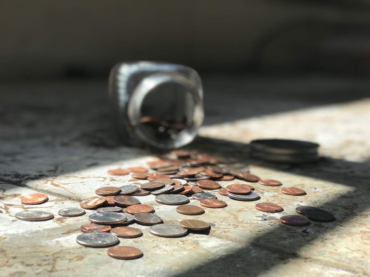 Pennies and marine adhesive sealant were a winning combination to fill in the holes in the bus floor.