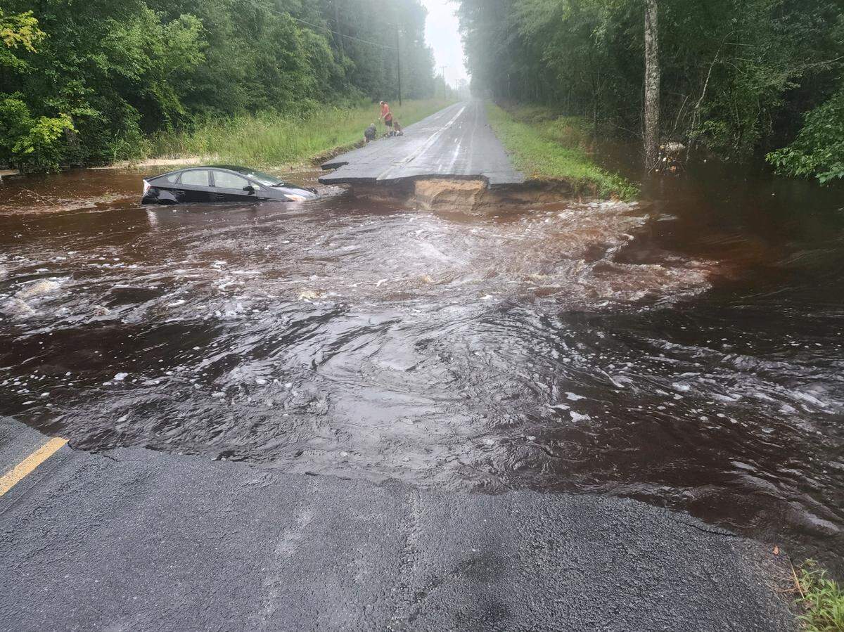 Quickly moving floodwaters from Tropical Storm Debby created a large washout on Langfordville Road, which branches west off U.S. 278 in northern Jasper County. A small car was swept into the murky water sometime Tuesday.