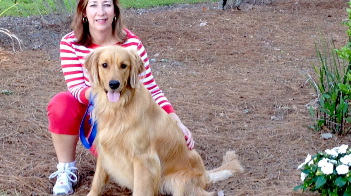 Pictured is newly-elected president of the Friends of Bluffton Dog Park Cheryl Raugh with her two-year-old Golden Retriever Boone.