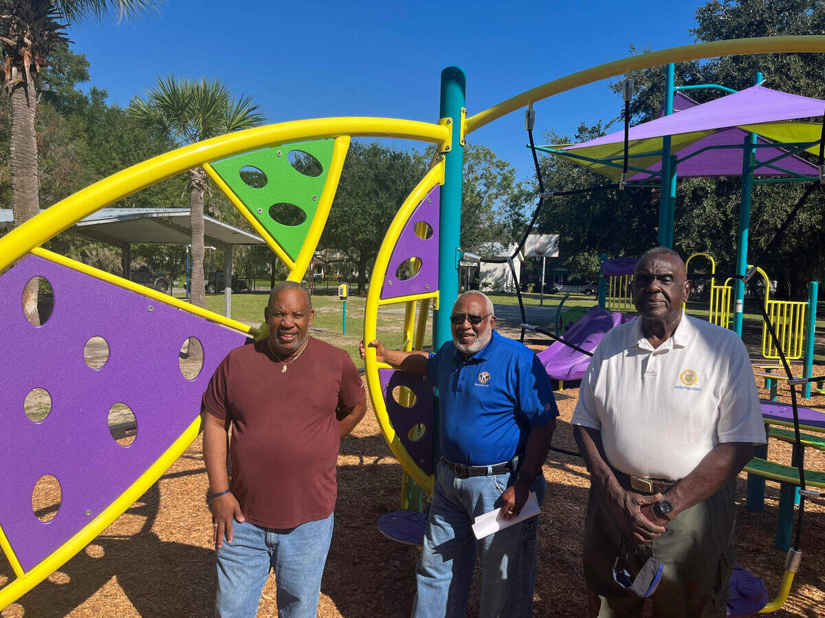 Charles Henderson, Bobby Jenkins and Ed Allen in front of playground equipment at Washington Street Park, where all three men played when they were growing up. The city, with the blessing of the not-for-profit that owns the park, is now seeking funding for additional improvements.