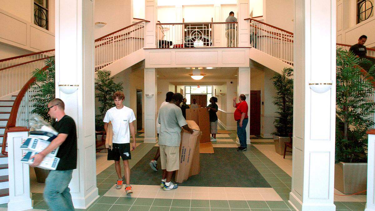 The new City Hall was bustling with activity Friday morning as employees got settled in and workers put the finishing touches on the building.