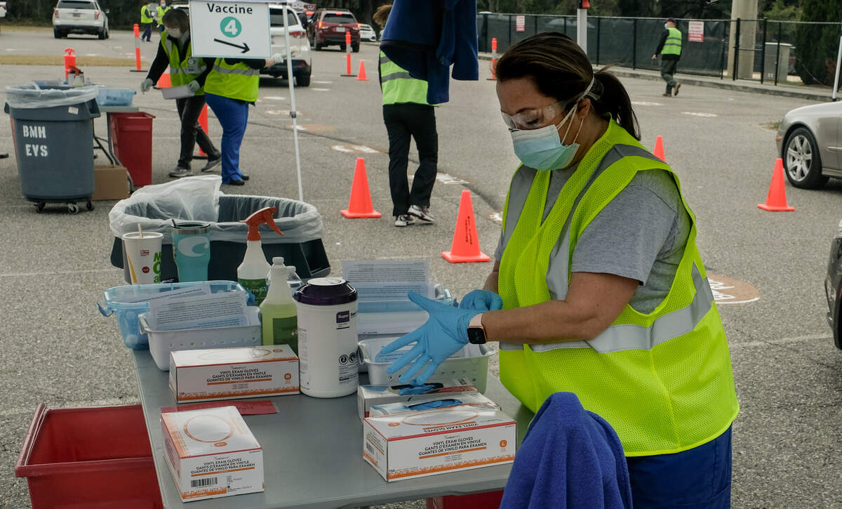 Summer Cook a Registered Nurse in the emergency department at Beaufort Memorial Hospital, prepares to administer a Pfizer-BioNTech’s vaccine on Thursday, Jan. 21, 2021 in the parking lot of Beaufort High School’s stadium. Thursday marked the first drive-thru clinic for vaccine administration in Beaufort County.