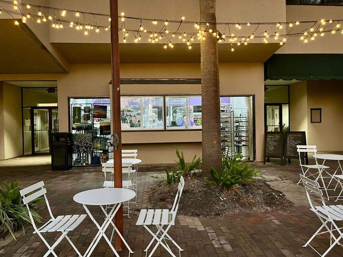 The Purple Cow’s new location offers a pop-up service window and outdoor seating.