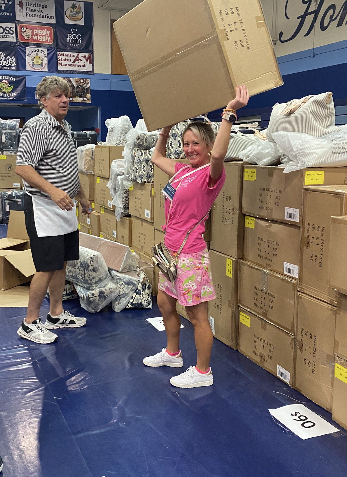 Spartina estimates will take 10 semi-trucks full of boxes, like these from the 2023 sale, to haul apparel to the school this year for its warehouse sale.