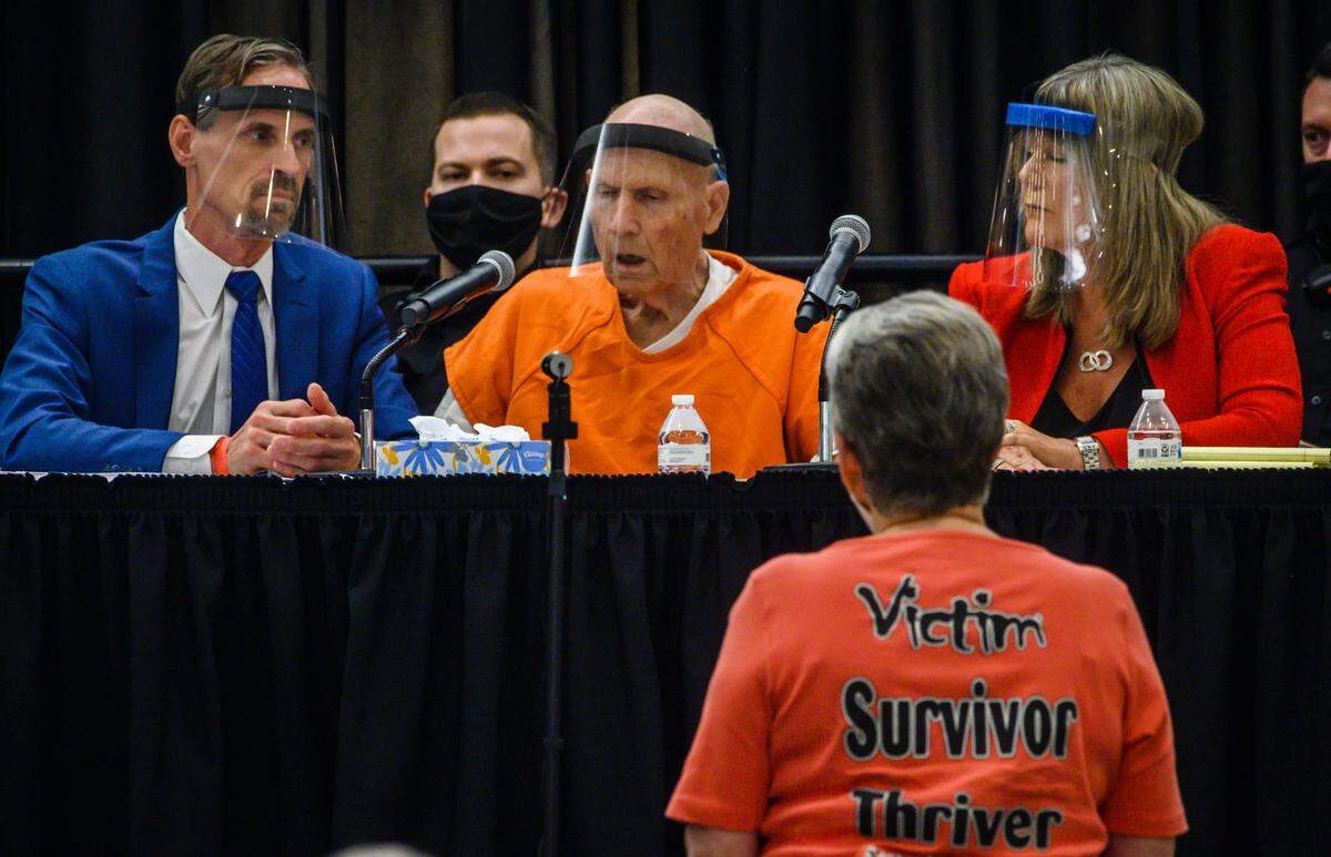 Jane Carson-Sandler, a victim of the East Area Rapist, approaches the defense table to confront Joseph James DeAngelo on Monday, June 29, 2020, while deputy district attorney Amy Holliday recounted Carson-Sandler’s case, and her description of DeAngelo as having a small penis. The moment drew cheers from the crowd. “I was hoping he would look at me,” she said afterward. “He didn’t, he just kept his head down.”
