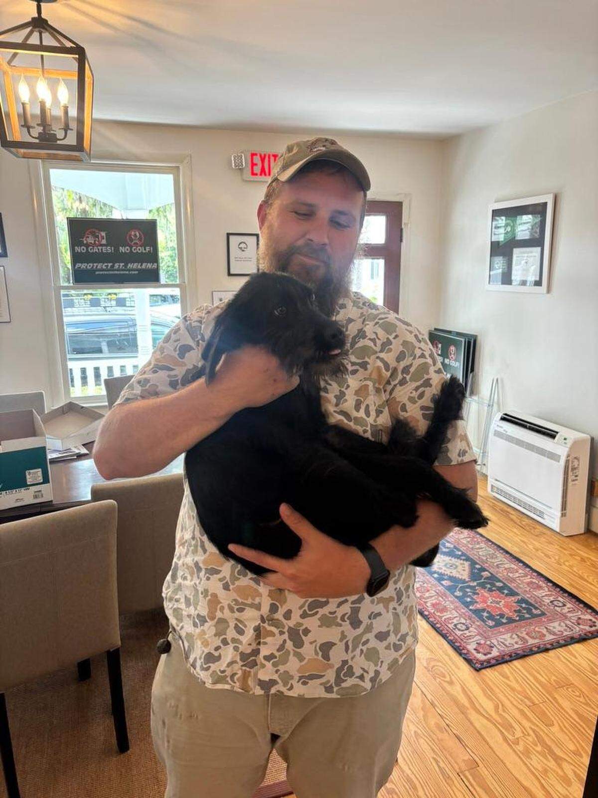 Caylor Romines, bringing rescue dog Otis Sheldon, safely back to the Open Land Trust office in downtown Beaufort.