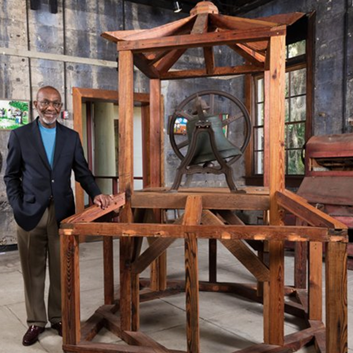 Marion Burns stands next to the original Penn School bell named after the Liberty Bell. Penn Center is the site of one of the first schools for newly freed African-Americans during the Civil War. Burns, who was interim executive director and chairman of the Board of Trustees, died Friday.