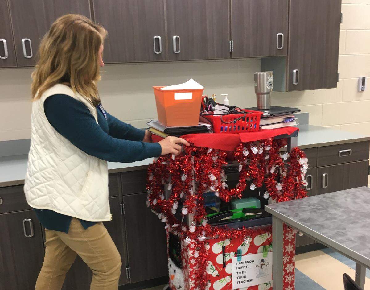 Rhonda Platt, a business teacher at May River High School, pushes her cart to her next classroom on Dec. 10, 2018.