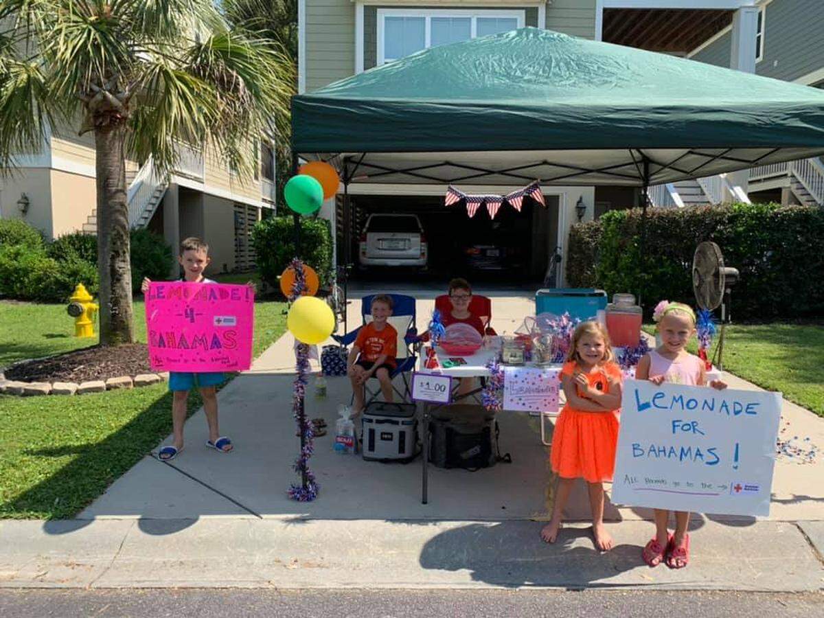Kids in the Jarvis Creek neighborhood on Hilton Head Island, SC, pose for a picture at their lemonade stand called “Lemonade for Bahamas” that raised money for Hurricane Dorian relief efforts.