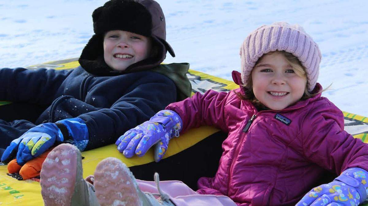In this submitted photo from Southern Pines Photography, Marshall and Sidney enjoy a day in the snow on Jan. 22, 2025, in Bluffton’s Cypress Ridge.