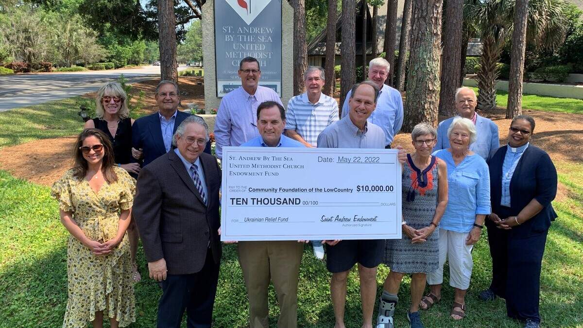 Representatives from the Ukraine Relief Fund, the Community Foundation of the Lowcountry and St. Andrew By-The-Sea Methodist Church are photographed at the donation of $10,000 to the HH4 Ukraine fund from the church’s endowment fund.