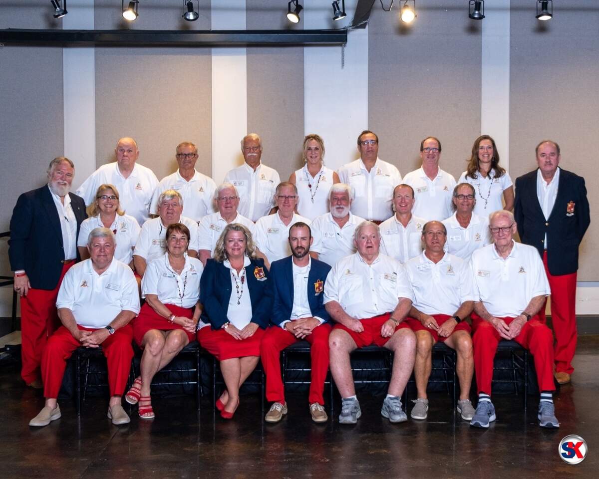 James Nutt, center, poses with past commodores at the Beaufort Water Festival Commodore’s Ball. Nutt was selected as the commodore for 2023, taking the reigns from Shawna Doran, the 2022 commodore, seated to his right.