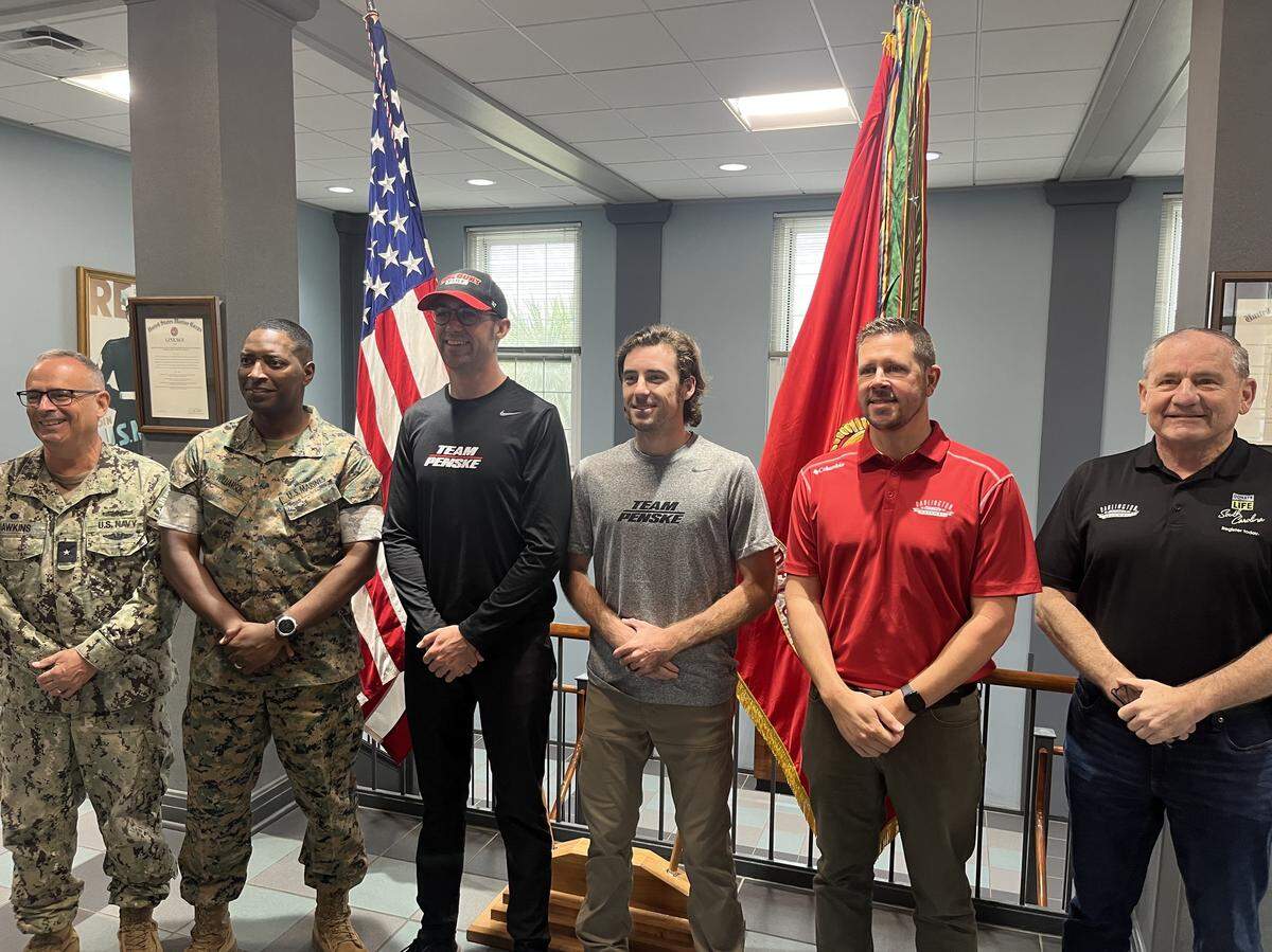 Professional race car drivers Austin Cindric and Ryan Blaney and Darlington Raceway Prsident Josh Harris pose for a photo with Marines at Parris Island Thursday. From left to right: Rear Admiral Robert Hawkins, Brig. Gen. Ahmad Williamson, Cindric, Blaney, Harris and Kevin Shwedo, executive director of the South Carolina Department of Motor Vehicles.