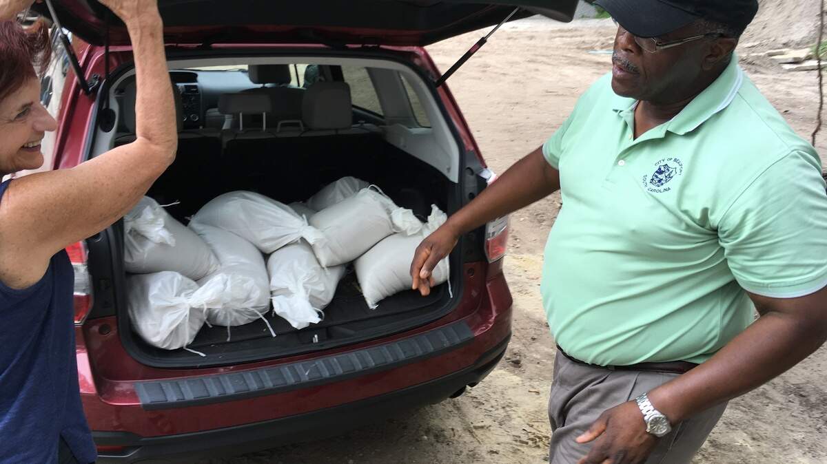 Beaufort public works director Lamar Taylor, right, helps load sandbags into a resident’s car in Southside Park on Thursday, Sept. 13, 2018. The city offered up to 12 free sandbags per car, and hundreds of cars came through ahead of expected heavy rain from Hurricane Florence.