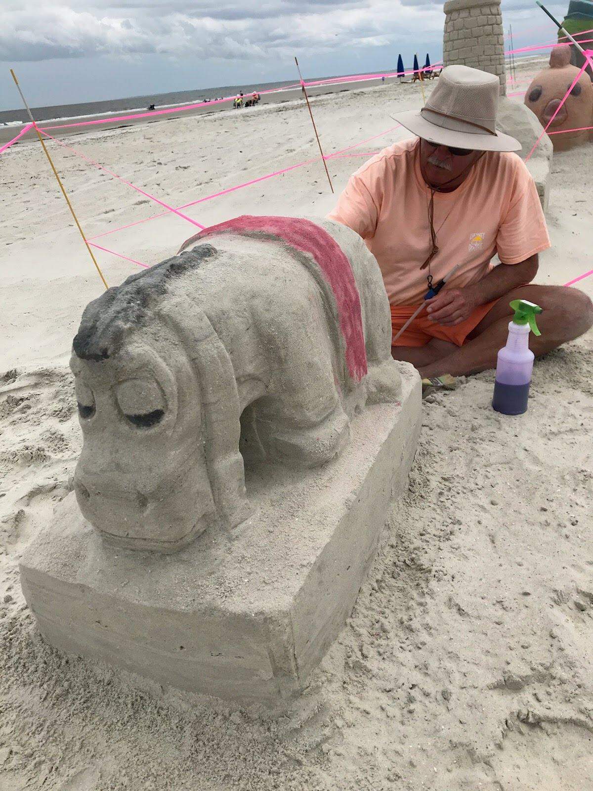 Doug Heatherington creates a sand sculpture on the Sea Pines beach on Hilton Head Island. In April 2021, he was fined $1,087.50 for leaving his sand sculptures up overnight.