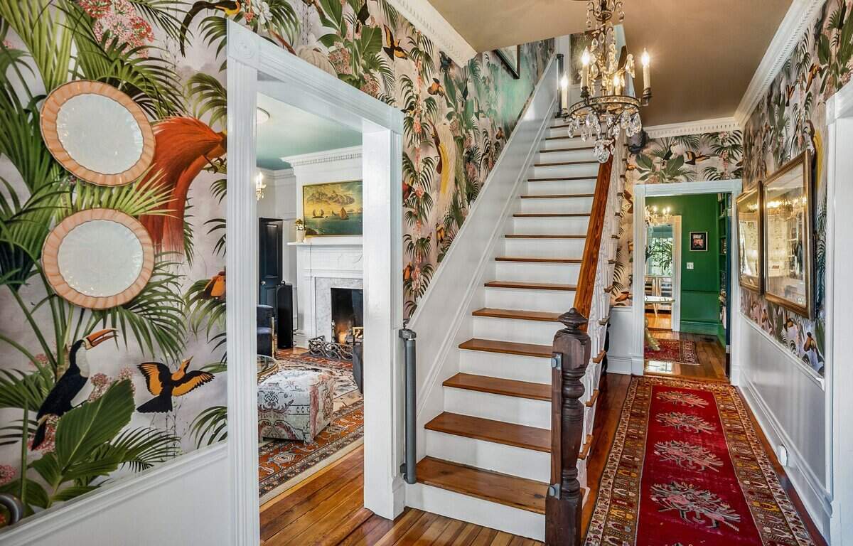 “Paridiso” wallpaper lines the front hall.