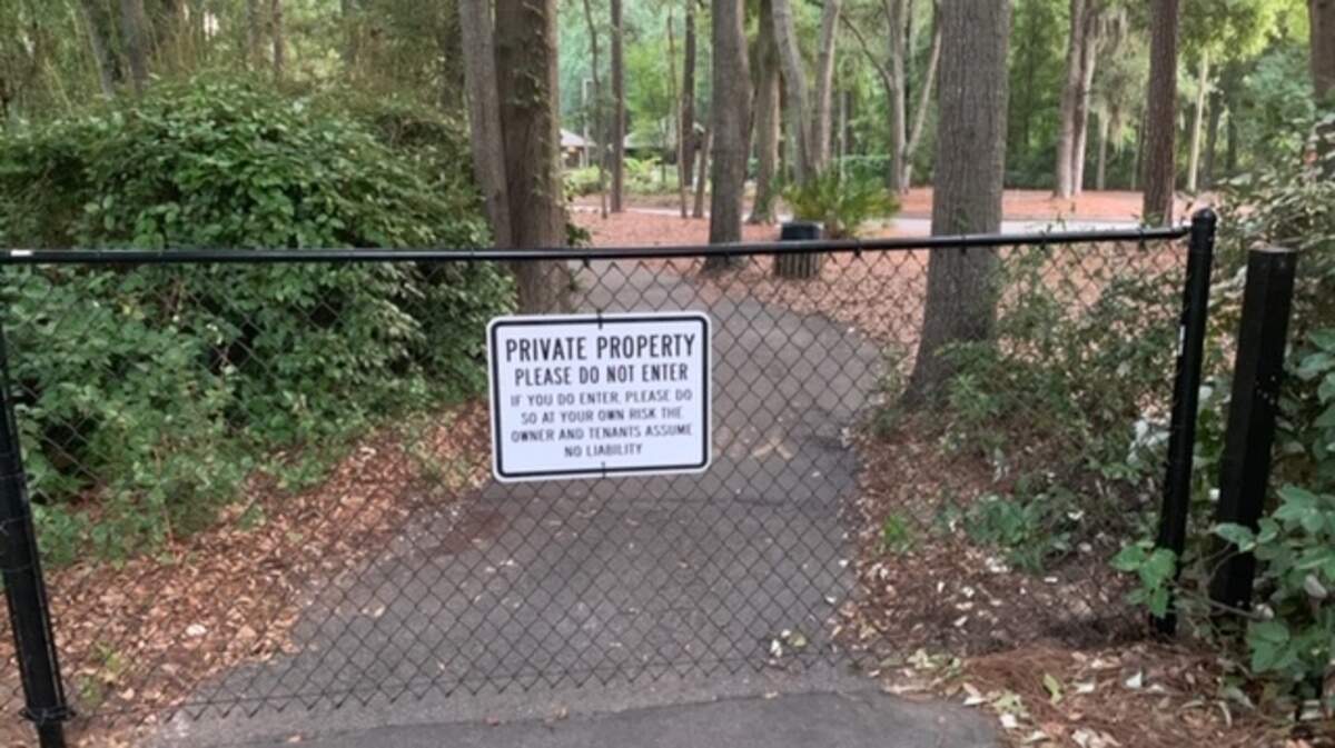 A fence blocking bike traffic near the entrance to Hilton Head Plantation on July 3, 2019. A property owners association near the pathway put up the fence to avoid liability since it empties into a parking lot.