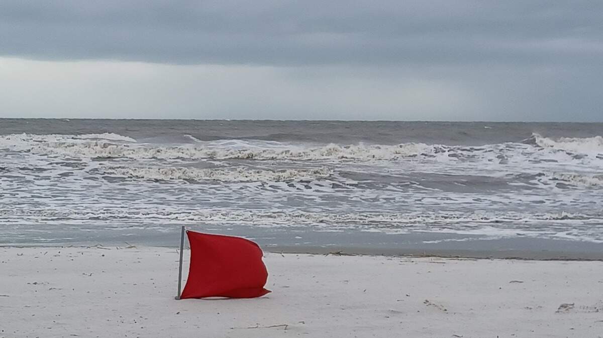 Red flags denote dangerous high surf or strong currents.