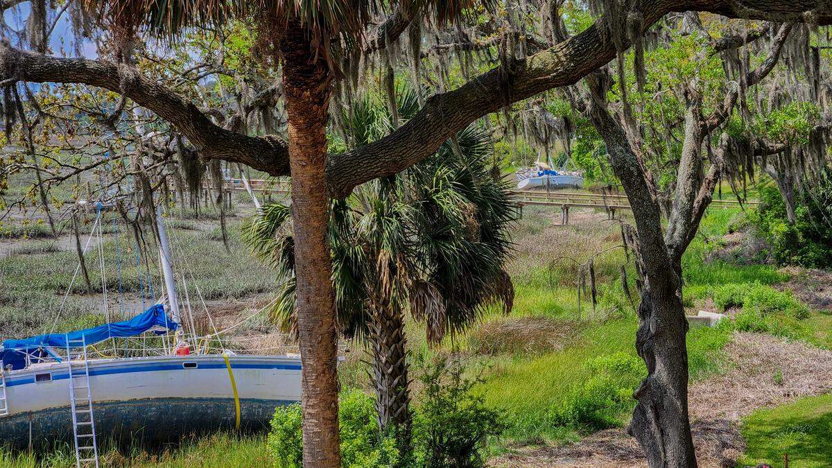 Grounded sailboats can be seen on April 23, 2025, on the bank of the Beaufort River in Historic Beaufort. O’Quinn Marine will remove five beached boats that were ripped from their Beaufort Marina moorings after Tropical Storm Helene in 2024.