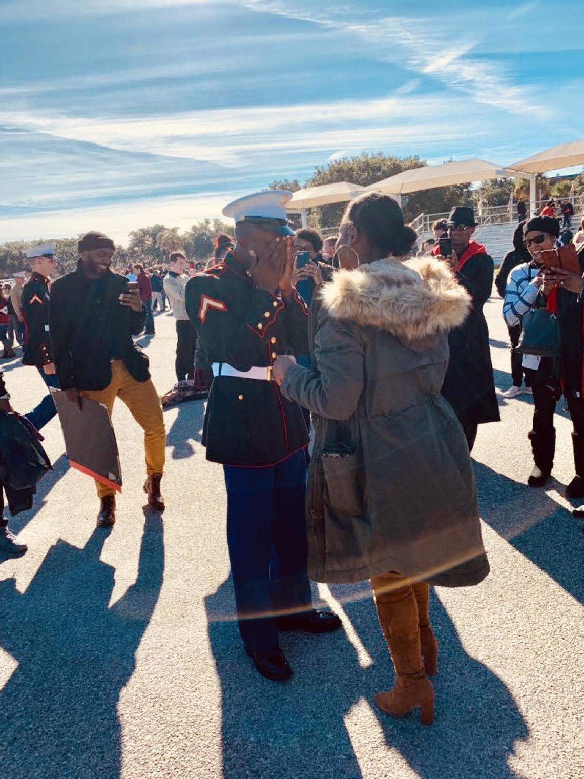 Marine Corps Sgt. Jevonna Williams surprises boyfriend and newly minted Marine Pvt. 1st Class Jamil Brown at boot camp graduation on Friday, Nov. 30, 2018, at Marine Corps Recruit Depot Parris Island.