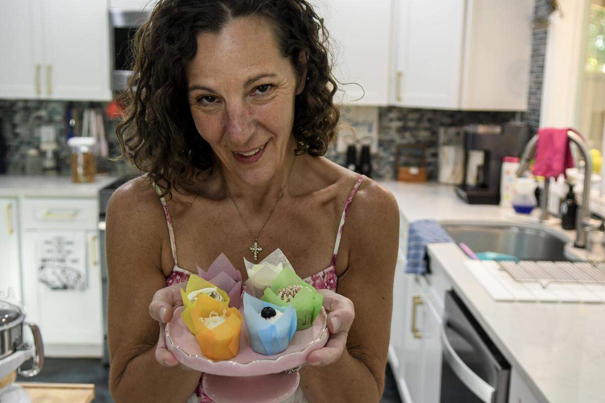 Nicole Lust, owner of Petite Sweets, displays miniature cupcakes on Aug. 26, 2025, she baked at her Hilton Head Island home.