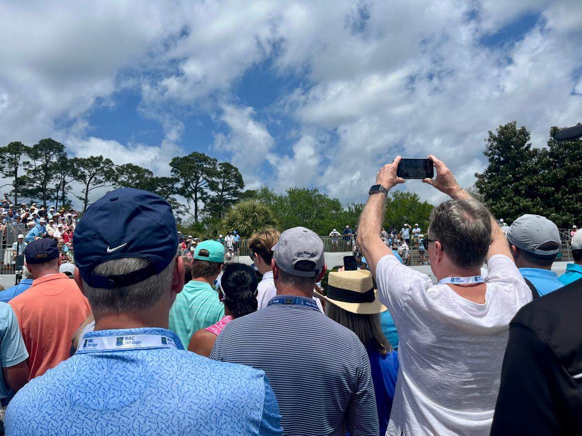Spectators gathered around the first hole to watch Justin Thomas tee off on Friday, April 18, 2025