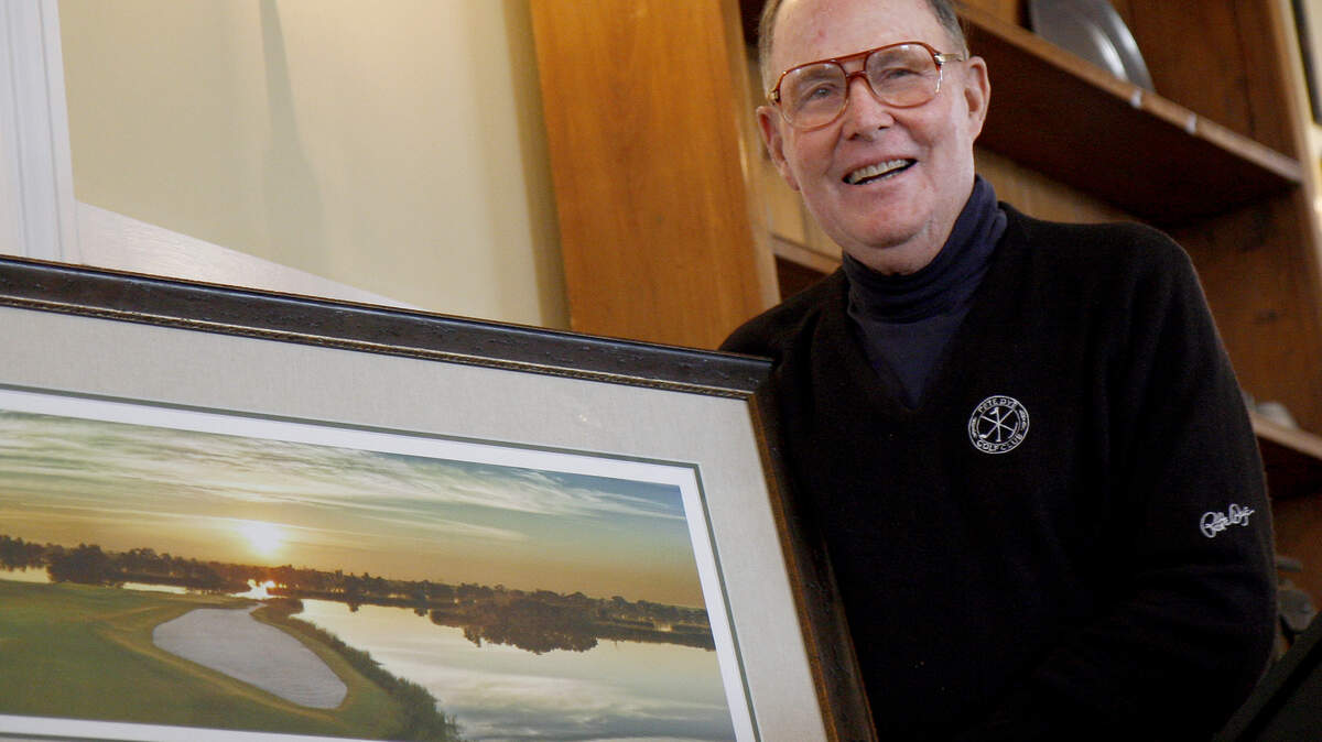 Pete Dye, shown holding a photo of a hole he helped design as part of a $7 million-plus update of The Ford Plantation's golf course in Richmond Hill, Ga., was not included in the first class named to the Lowcountry Golf Hall of Fame. Dye helped design Harbour Town, including the emblematic 17th and 18th holes that run along Calibogue Sound.