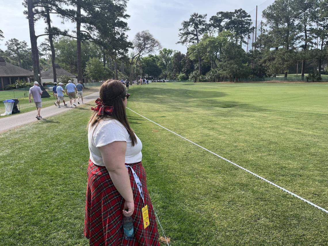 Dressed in plaid, Lainey Creason, Kansas watches the action on No. 9 Saturday at the RBC Heritage on Hilton Head Island.