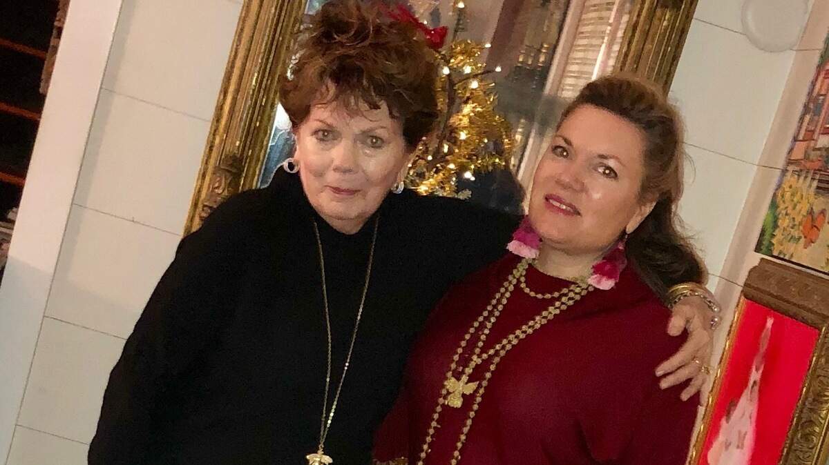Babbie and Catherine Guscio rock around the Christmas tree!