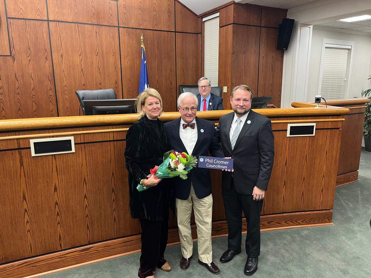 Phil Cromer, center -- with his wife, Amelie, left, Mayor Stephen Murray, right, and Councilman Neil Lipsitz, back -- said goodbye to city service Tuesday after 8 years on the City Council.