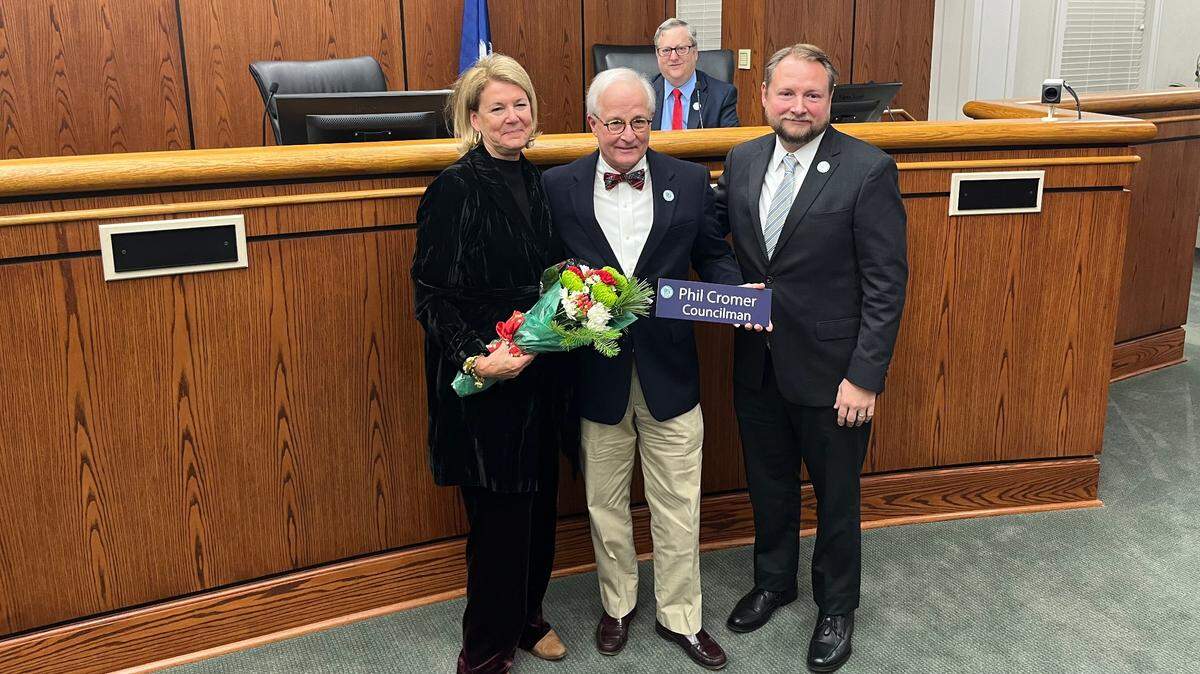 Phil Cromer, center -- with his wife, Amelie, left, Mayor Stephen Murray, right, and Councilman Neil Lipsitz, back -- said goodbye to city service Tuesday after 8 years on the City Council.