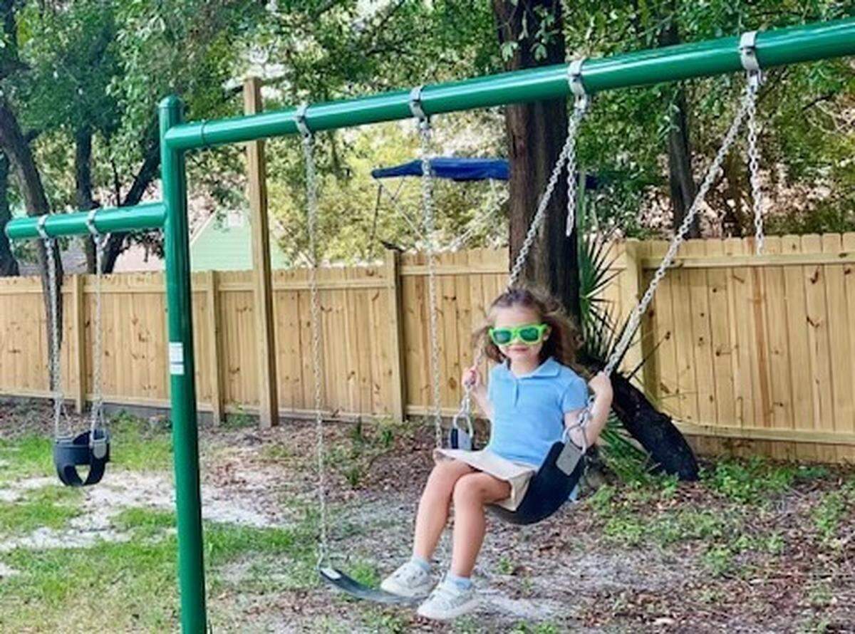 Emma Christofek checks out the new swing set that’s part of the playground for kids at the new restaurant GG’s in Port Royal.