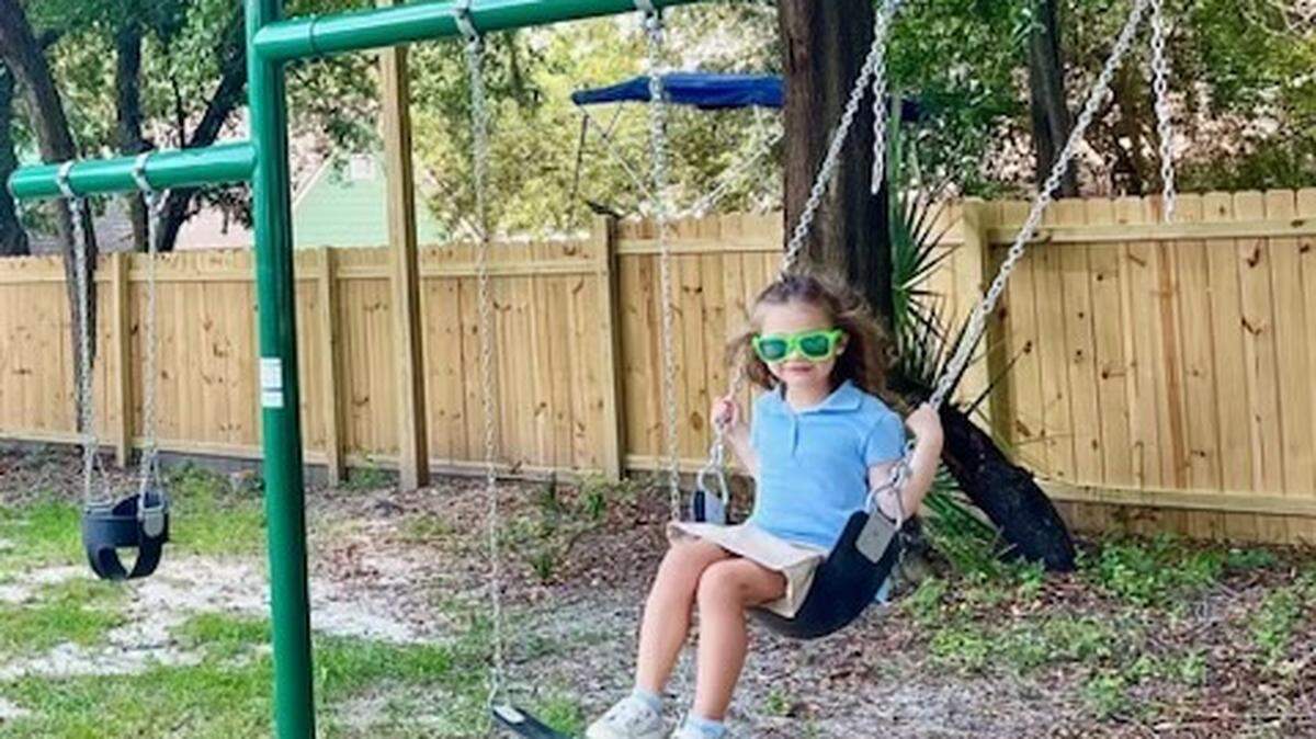 Emma Christofek checks out the new swing set that’s part of the playground for kids at the new restaurant GG’s in Port Royal.