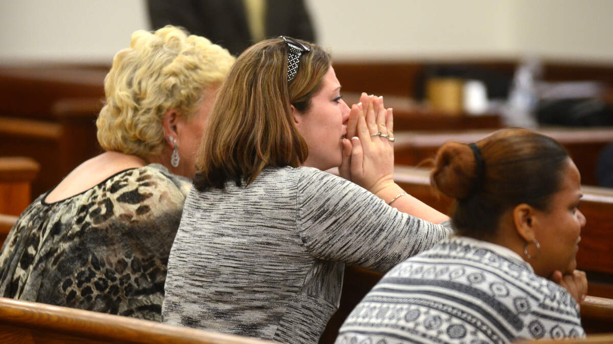 Members of Joseph Bowers’ family, including fiancee Megan Stone, center, react after the verdict is read Wednesday night.